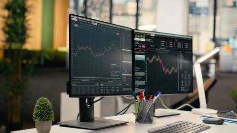 Stock exchange insights displayed on computer screens in hedge fund office Stock Photos