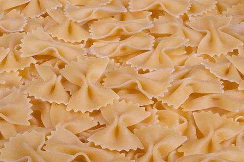 Stock farfalle bowshaped pasta pattern, highresolution dry pasta arrangemen.. Stock Photos