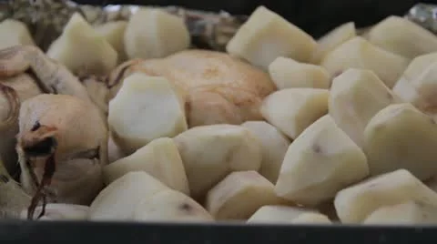 Stock Footage- Chicken and Potatoes Roasting in Pan - Close up - Steaming Stock Footage