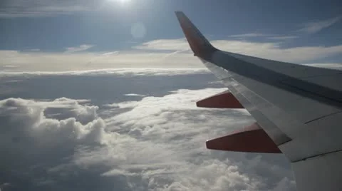 Stock Footage - HD 1080p - Commercial Jet Cruising over Clouds - Audio Stock Footage