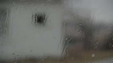 Stock Footage - Rain in window - Whit house - Cars pass Stock Footage