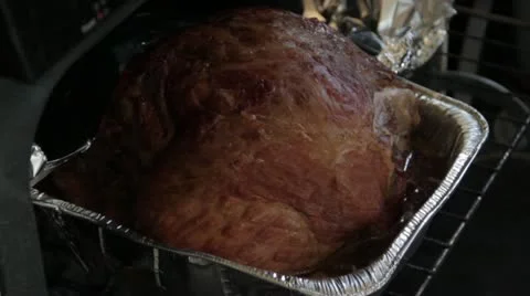 Stock Footage- Roasting Ham - Cover With Foil - Close Oven - Golden Brown Stock Footage