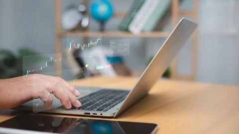 Stock graphs and various indicators on the computer screen on a dark backgr.. Stock Photos