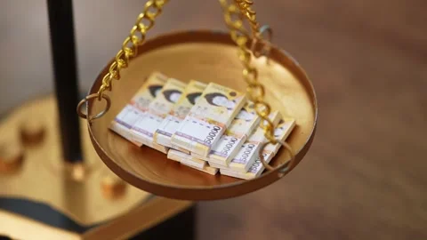 Stock image featuring scales and money Stock Footage 321931506