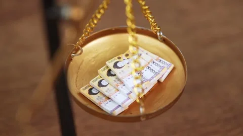 Stock image featuring scales and money Stock Footage 321931940