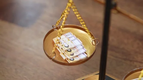 Stock image featuring scales and money Stock Footage 321932917