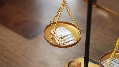 Stock image featuring scales and money Stock Footage 321932998