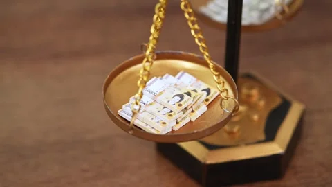 Stock image featuring scales and money Stock Footage 321935680