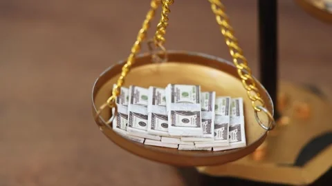 Stock image featuring scales and money Stock Footage 321939737