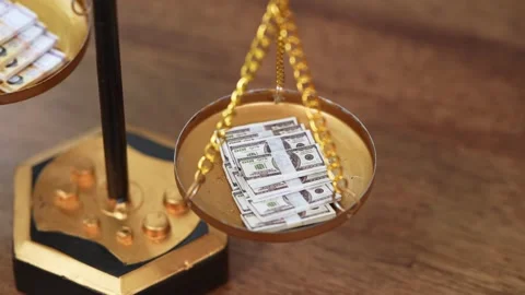Stock image featuring scales and money Stock Footage 321942056