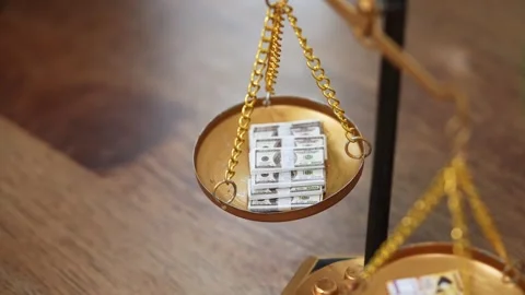 Stock image featuring scales and money Stock Footage 321942460