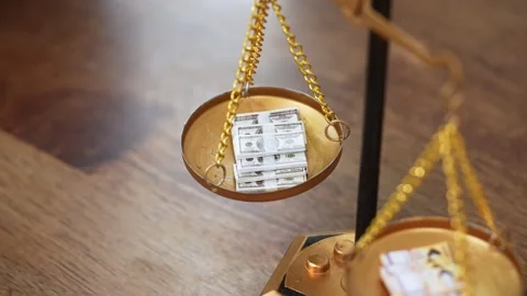 Stock image featuring scales and money Stock Footage 321942896