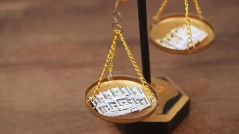 Stock image featuring scales and money Stock Footage 321943468