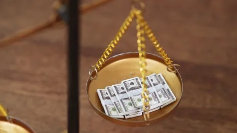 Stock image featuring scales and money Stock Footage 321944214