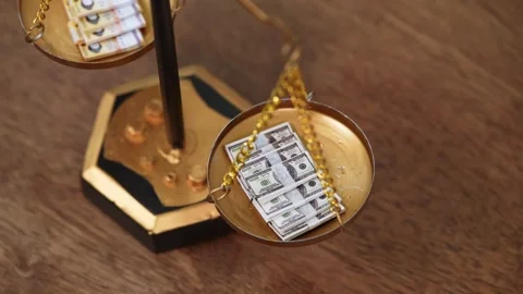 Stock image featuring scales and money Stock Footage 321946275