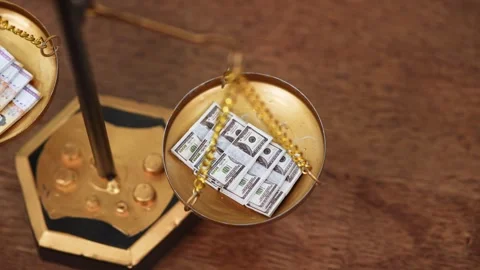 Stock image featuring scales and money Stock Footage 321947093