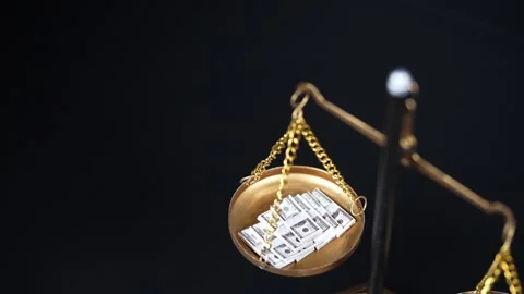 Stock image featuring scales and money Stock Footage 321970520