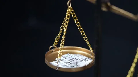 Stock image featuring scales and money Stock Footage 321971233