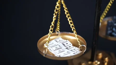 Stock image featuring scales and money Stock Footage 321971885
