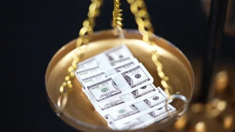 Stock image featuring scales and money Stock Footage 321972402