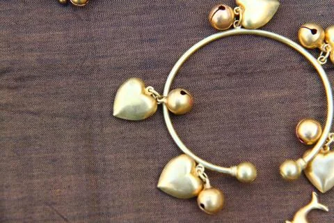 Stock image a golden bracelets on background Stock Photos