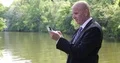 Stock Market Agent Outside Office Use Tablet Check Schedule Business Meeting Day 4k or 4k+ Resolution