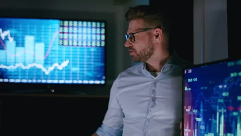 Stock market analyst working in front of computer screen Stock Footage 289727964