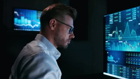 Stock market analyst working in front of computer screen Stock Footage 316600588