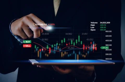 Stock market chart business using a tablet to analyze online trading data.For Stock Photos
