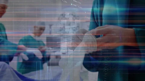 Stock market data processing against mid section of surgeon wearing surgical Stock Footage 328359553