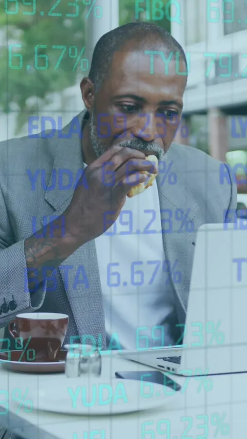 Stock market data processing against african american senior man having a snack Stock Footage 331646404