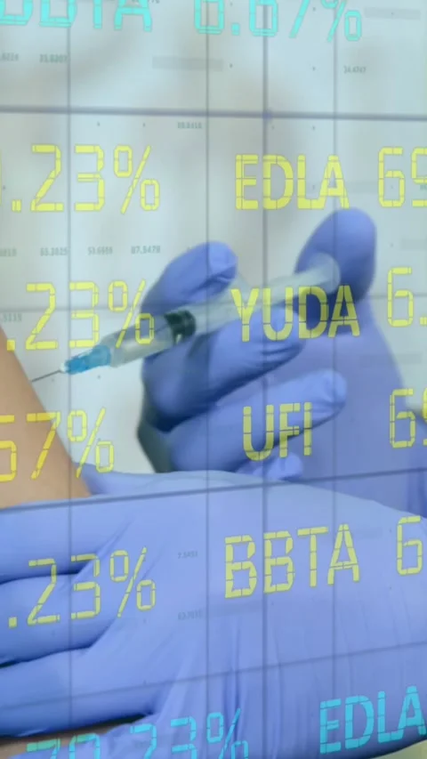 Stock market data processing against mid section of doctor giving injection to Stock Footage 343713975