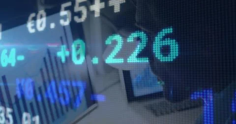 Stock market data processing against caucasian man using laptop at office Foto stock