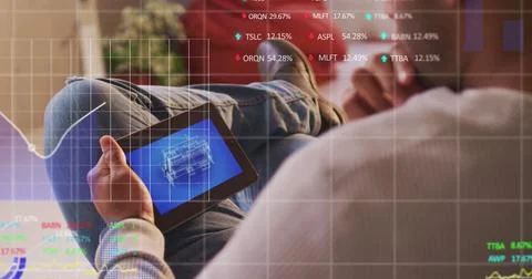 Stock market data processing against mid section of man using digital tablet 스톡 사진