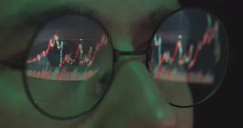 Stock market trader looking at graph of share prices, male broker in glasses Video stock 158645839