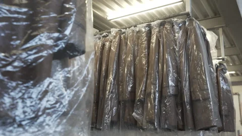 Stock of sheathed clothes in the warehouse Stock Footage 138014785