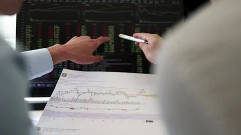 Stock traders analyzing stock market trends Stock Footage 292649033