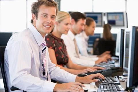 Stock Traders Working At Computers Foto stock
