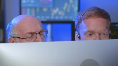 Stock traders working in office Stock Footage 116096406