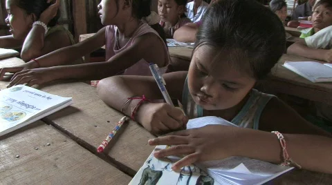 Stock Video of Cambodia: Children learn to read and write Stock Footage