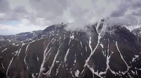 Stock Video Footage Alpine Flying black mountain white cloud Stock Footage 40468142