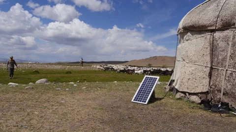 Stock video footage yurt nomad and a flock of sheep and solar panels Stock Footage 40582353