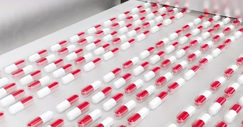 Stock video, the process of production of pills, tablets, red-white capsules Video stock 80399140