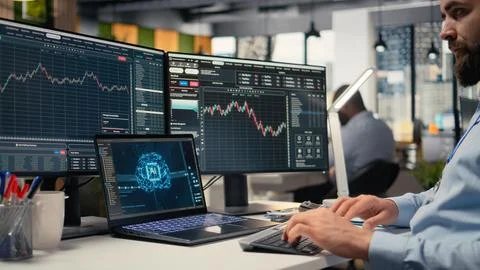 Stockbroker using deep learning technology on laptop Stock Photos
