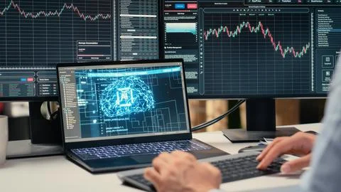 Stockbroker using deep learning technology on laptop Stock Photos