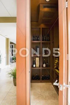 Stocked modern wine cellar in home Stock Photos