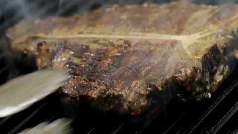 Stocked steak on grill. Grilling Steak Video stock 104084151