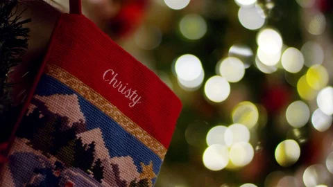 Stocking rack focus to Christmas tree Stock Footage 88601340