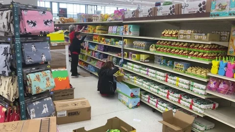 Stocking Shelves with Easter Candy Stock Footage 170465614