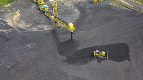 Stockpile activity in a coal mine on one of Kalimantan's islands Stock Footage 242128053